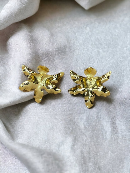 A pair of gold-plated bronze stud earrings designed to resemble an orchid flower.