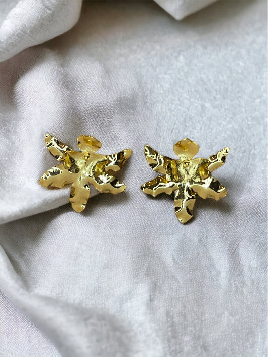 A pair of gold-plated bronze stud earrings designed to resemble an orchid flower.