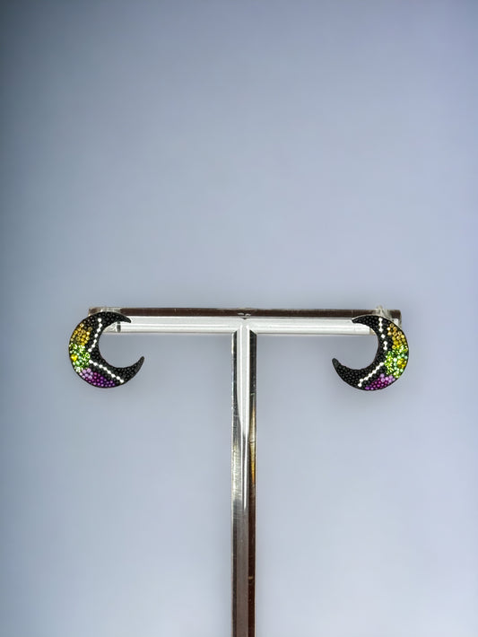 A pair of black half moon shaped earrings embellished with green, yellow, and purple crystals, mounted on a silver 925 studs style earring post.