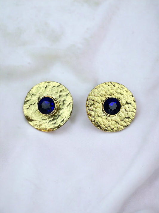 Colombian_handcrafted_rounded_earrings_plated_in_gold_light_weight_with_a_bright_dark_blue_natural_crystal_in_the_center