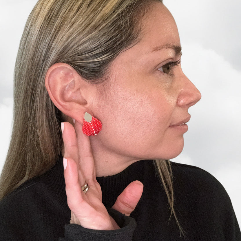 Person wearing a red beaded earring, miyuki earrings, silver earrings, s925 earrings, red earrings