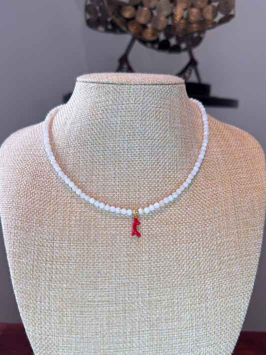 natural white gemstone necklace with a red coral pendant in the middle