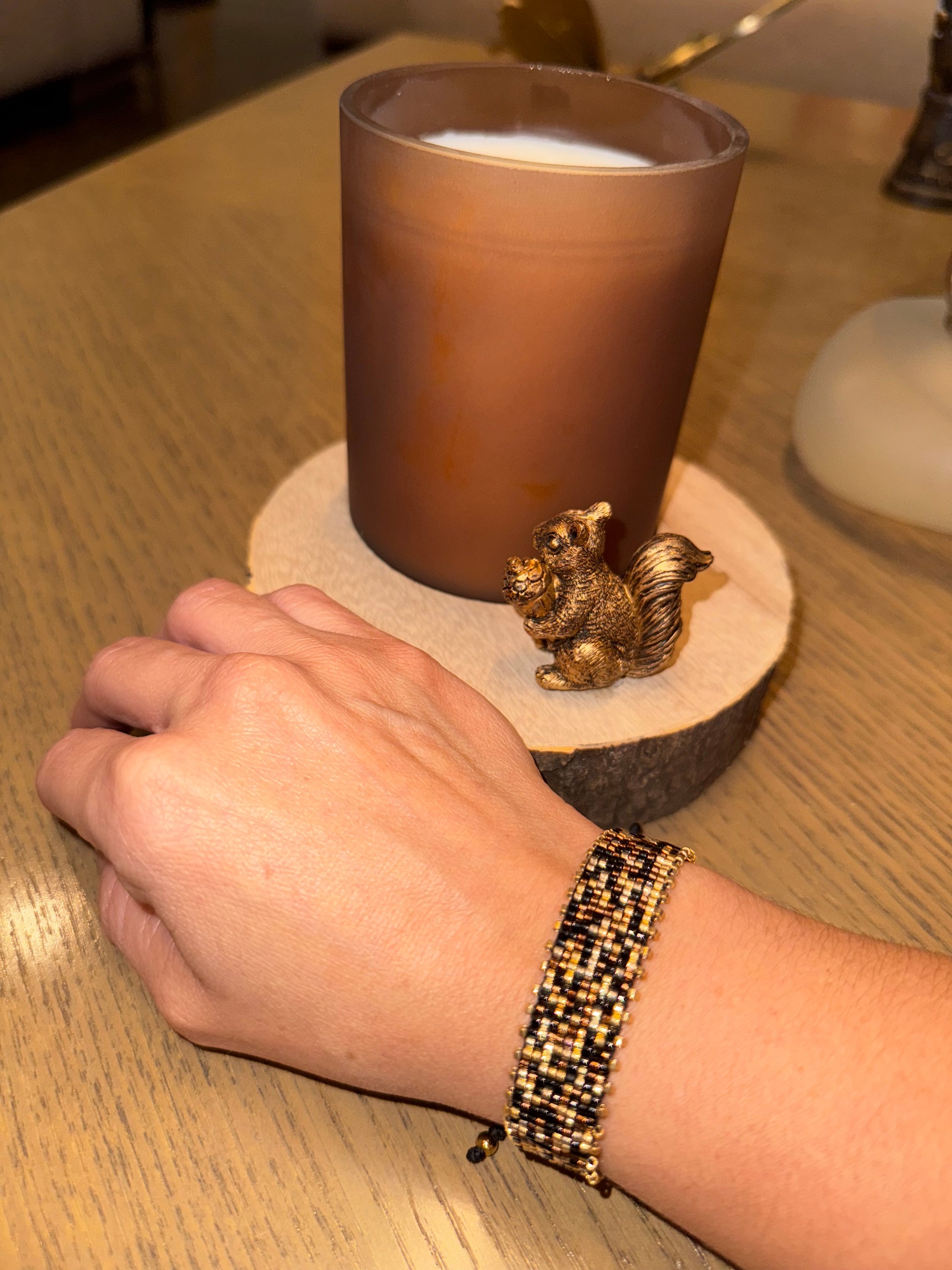 Hand wearing a beaded bracelet