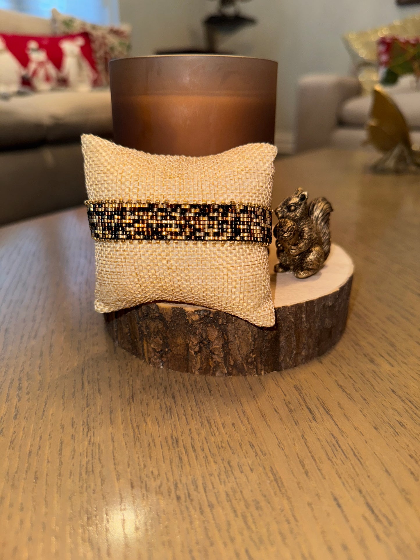  metallic bracelet on a wooden surface.