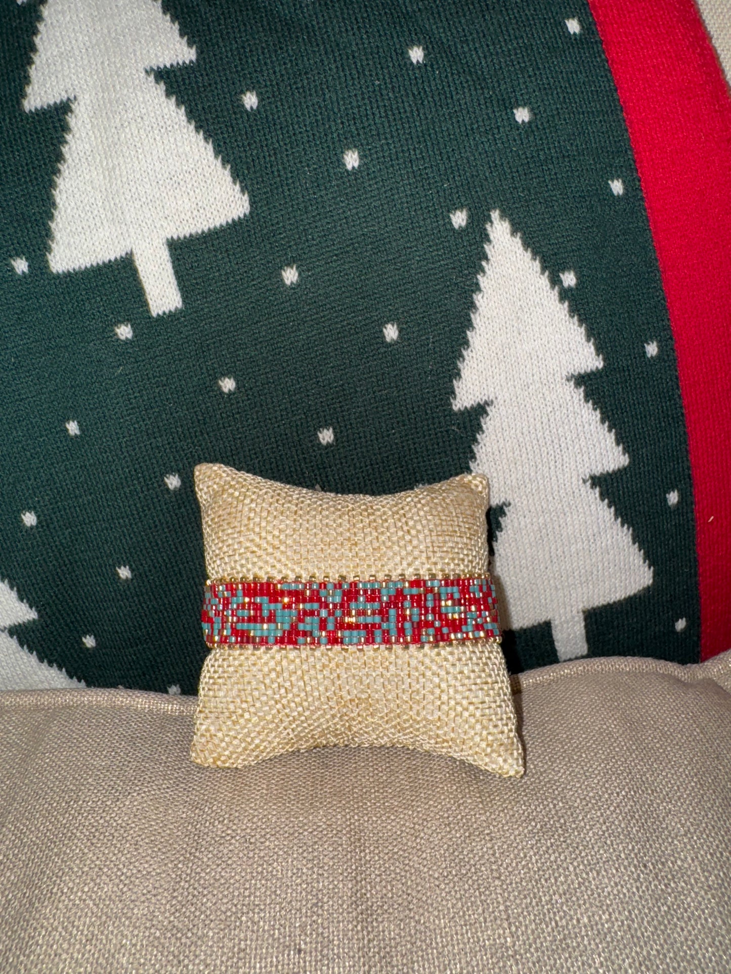 Small decorative pillow with a red and blue pattern 