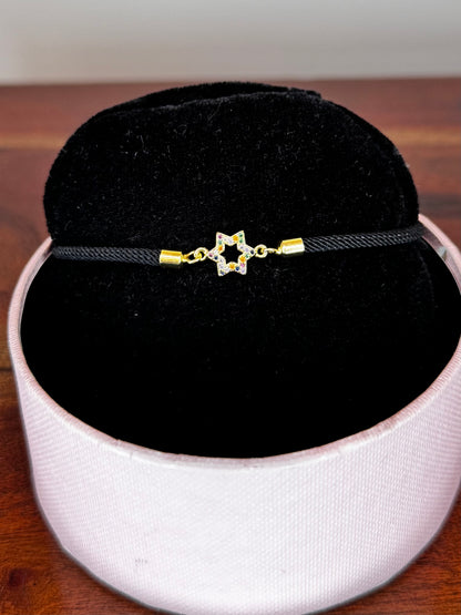 Black bracelet with a star-shaped clasp 