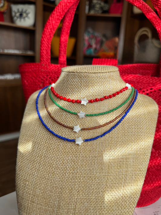 handmade beaded choker style necklace with mother of pearl star pendant in the centre 