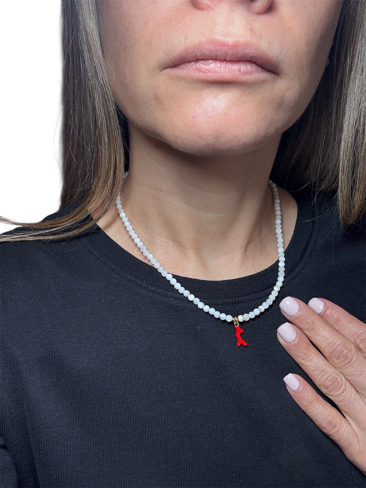natural white gemstone necklace with a red coral pendant in the middle